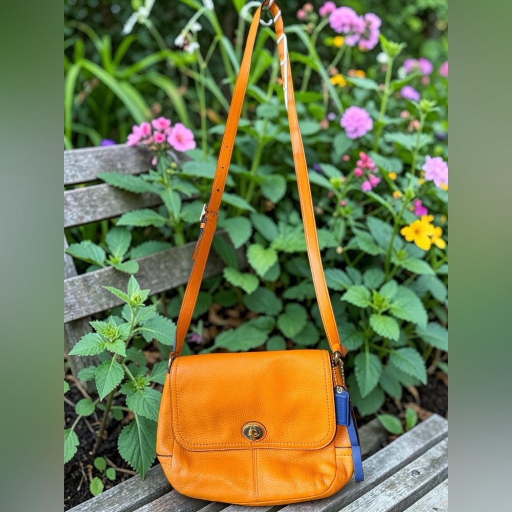Orange turn lock coach crossbody bag